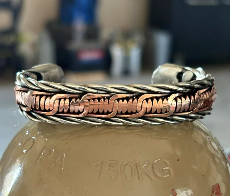 Copper barbwire weave cuff bracelet with stainless twisted rope edges.