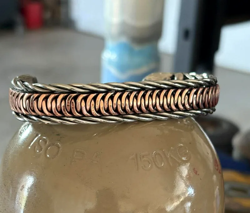 Copper snake belly weave cuff bracelet framed by stainless twisted rope edges.